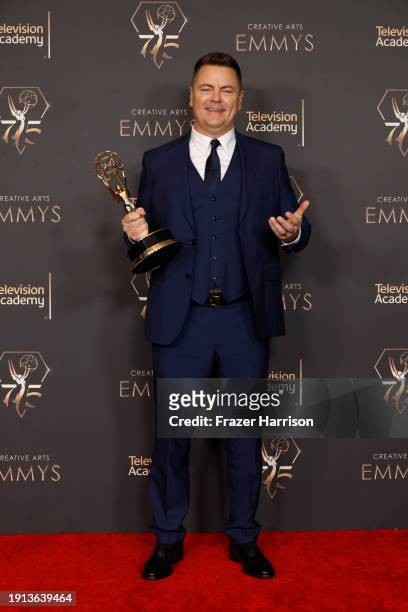 Nick Offerman poses with the Outstanding Guest Actor in a Drama Series award during the 2024 Creative Arts Emmys at Peacock Theater on January 06,...