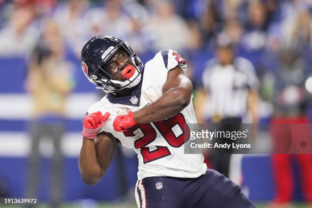 Devin Singletary of the Houston Texans celebrates a touchdown during the fourth quarter against the Indianapolis Colts at Lucas Oil Stadium on...