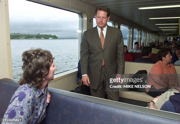 Democratic presidential candidate US Vice President Al Gore talks to a passenger aboard the ferry Wenatchee that takes commuters between Seattle,...