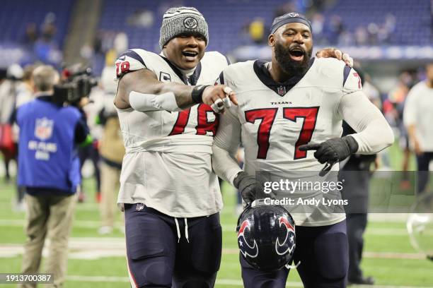 Laremy Tunsil George Fant of the Houston Texans react after the game against the Indianapolis Colts at Lucas Oil Stadium on January 06, 2024 in...