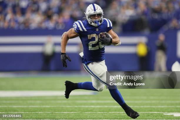 Jonathan Taylor of the Indianapolis Colts runs with the ball during the fourth quarter against the Houston Texans at Lucas Oil Stadium on January 06,...