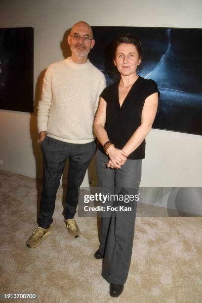 Visual artists Stéphane Guiran and Katarzyna Kot pose with their work during Galerie Pierre Alain Challier’s Galette des Rois Party as part of "La...