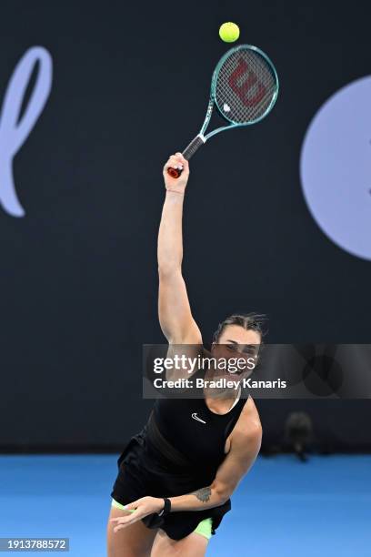 Aryna Sabalenka of Belarus serves in her final match against Elena Rybakina of Kazakhstan during day eight of the 2024 Brisbane International at...