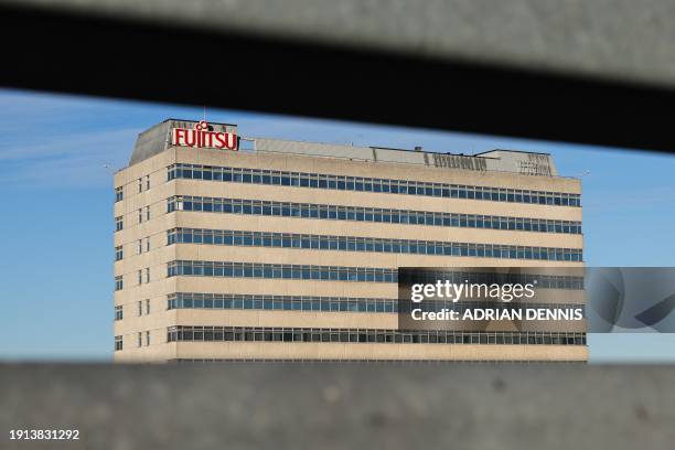 Photograph taken on January 10, 2024 shows the logo of the Japanese multinational information and communications technology equipment and services...