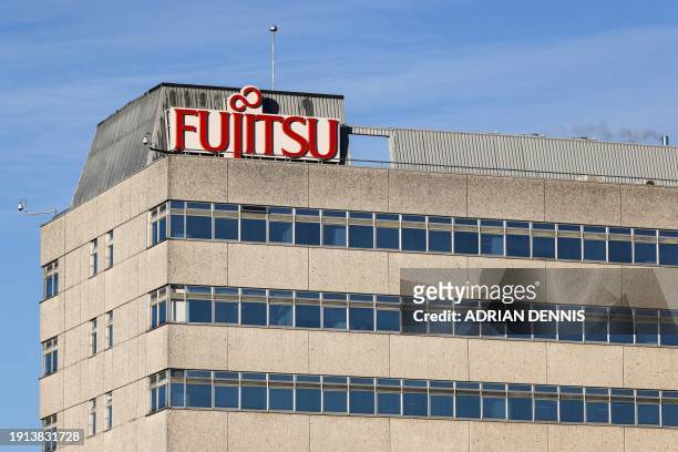 Photograph taken on January 10, 2024 shows the logo of the Japanese multinational information and communications technology equipment and services...