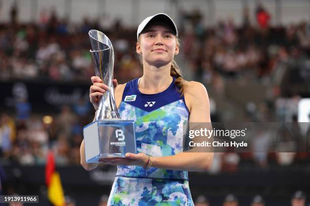 Elena Rybakina of Kazakhstan poses with the trophy after winning her final match against Aryna Sabalenka of Belarus during day eight of the 2024...