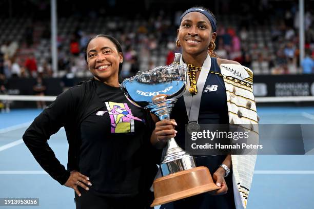 Candi Gauff and Coco Gauff of USA celebrate with the trophy after winning the Women's singles final match against Elina Svitolina of Ukraine during...