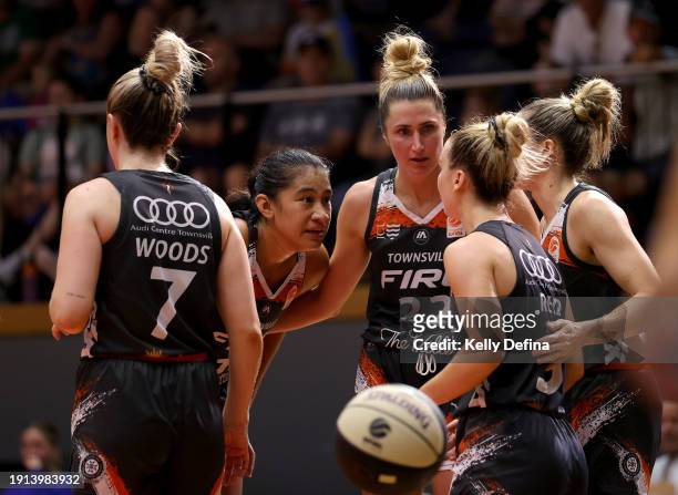 Cassandra Brown of the Fire and Zitina Aokuso of the Fire speak to team mates during the WNBL match between Bendigo Spirit and Townsville Fire at...