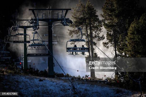 Skiers ride a lift over scrubland at La Molina ski resort in Girona, Spain, on Tuesday, Jan. 9, 2024. Europe has been hard hit by climate...
