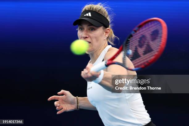 Angelique Kerber of Germany plays a forehand in their finals match against Iga Swiatek of Poland during the 2024 United Cup at Ken Rosewall Arena on...