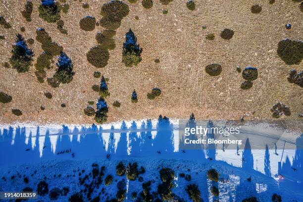 Dry ground alongside a ski run at La Molina ski resort in Girona, Spain, on Tuesday, Jan. 9, 2024. Europe has been hard hit by climate change-fueled...