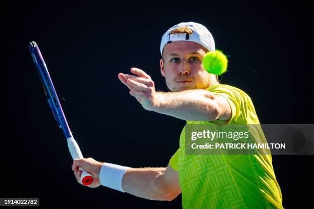 Belgian Gauthier Onclin pictured in action during a tennis match against US Kovacevic in the first round of the qualifiers for the men's singles...