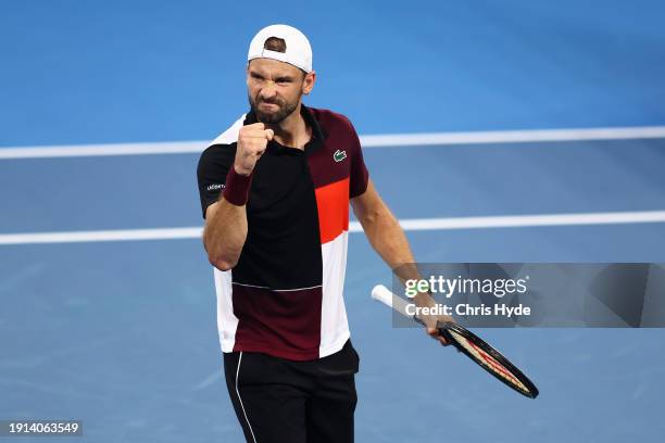 Grigor Dimitrov of Bulgaria celebrates set point in his final match against Holger Rune of Denmark during day eight of the 2024 Brisbane...