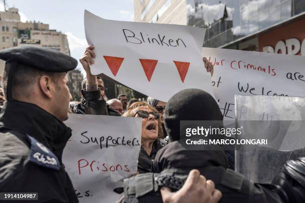 Palestinians are confronted by Palestinian Authority security forces as they protest during a visit by US Secretary of State Antony Blinken in...