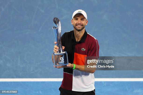 Grigor Dimitrov of Bulgaria holds the winners trophy after his final match against Holger Rune of Denmark during day eight of the 2024 Brisbane...