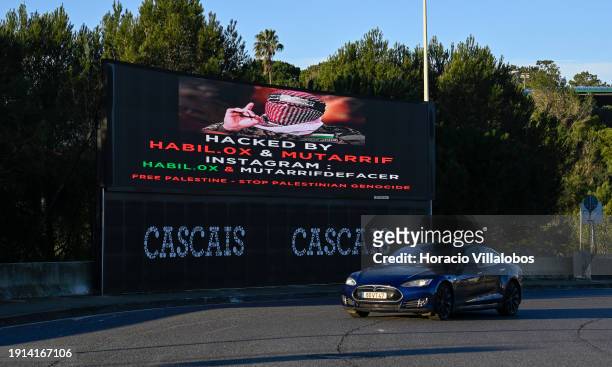 Car drives by a large new electronic information billboard recently inaugurated by Cascais Municipality at the Avenida Condes de Barcelona and A5...