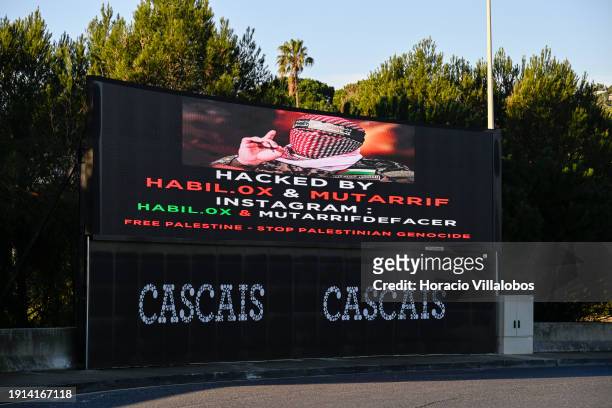 Pro-Palestine hackers post a "Free Palestine" sign at a large new electronic information billboard recently inaugurated by Cascais Municipality at...