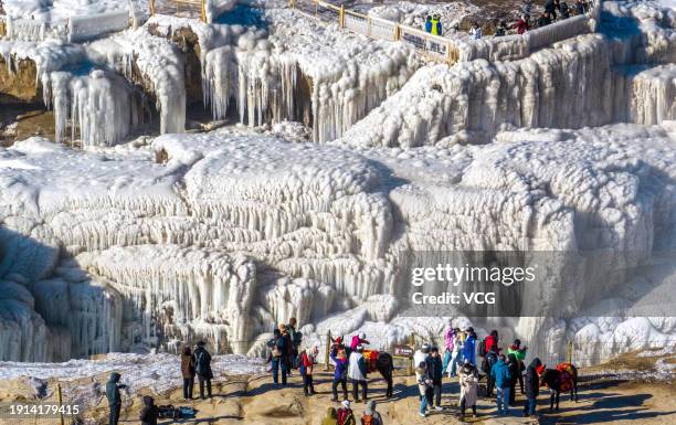 Freezing winter air turns Hukou Waterfall into an icy wonderland on January 6, 2024 in Linfen, Shanxi Province of China.