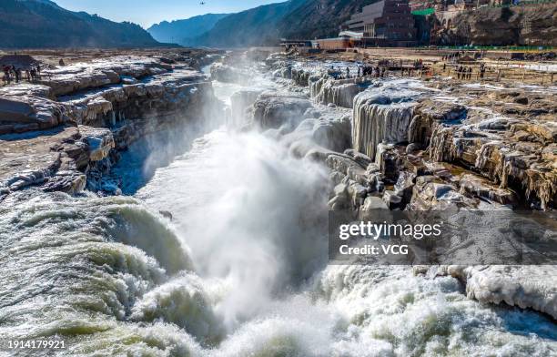 Freezing winter air turns Hukou Waterfall into an icy wonderland on January 6, 2024 in Linfen, Shanxi Province of China.