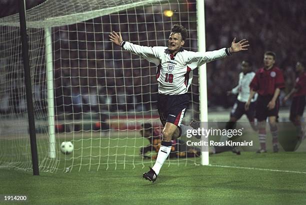 Teddy Sheringham of England celebrates after scoring England's first goal during the World Cup Qualifier against Georgia at Wembley Stadium in...