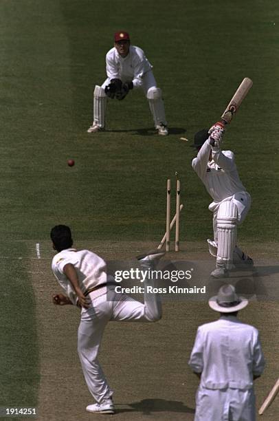 Chris Tolley of Nottinghamshire is bowled by Mohammed Akram of Northamptoshire during the Benson and Hedges Cup match at Trent Bridge in Nottingham,...