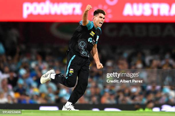 Xavier Bartlett of the Heat celebrates dismissing Corey Anderson of the Hurricanes during the BBL match between Brisbane Heat and Hobart Hurricanes...