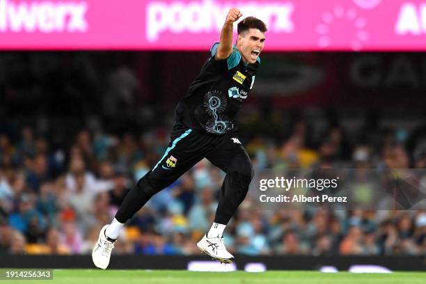 Xavier Bartlett of the Heat celebrates dismissing Corey Anderson of the Hurricanes during the BBL match between Brisbane Heat and Hobart Hurricanes...