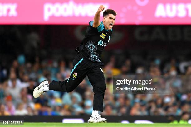 Xavier Bartlett of the Heat celebrates dismissing Corey Anderson of the Hurricanes during the BBL match between Brisbane Heat and Hobart Hurricanes...