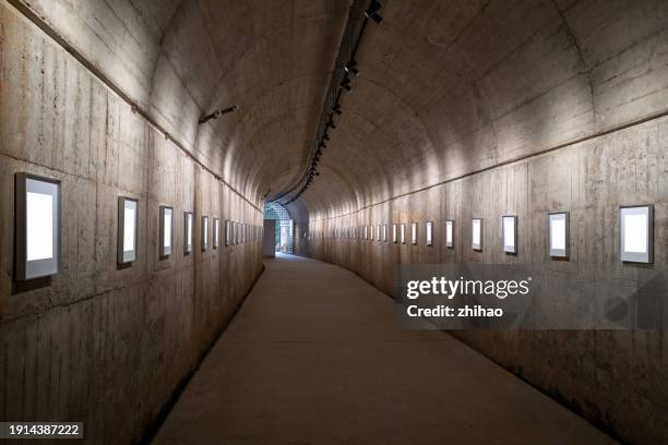 concrete dugout corridor with picture frames - dugout shelter stock pictures, royalty-free photos & images