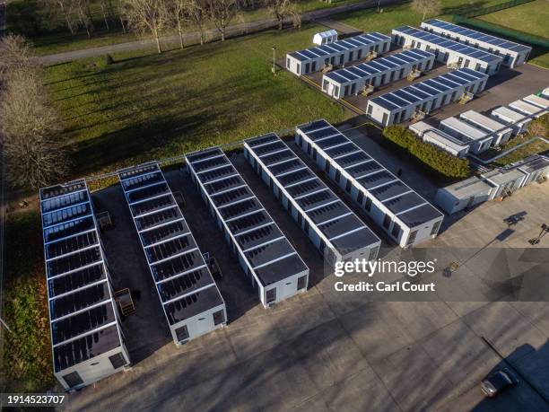 Temporary accommodation units housing migrants are pictured on the MDP Wethersfield Ministry of Defence facility on January 10, 2024 in Wethersfield,...