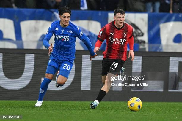 Alejandro Jimenez of AC Milan competes for the ball with Matteo Cancellieri of Empoli FC during the Serie A TIM match between Empoli FC and AC Milan...