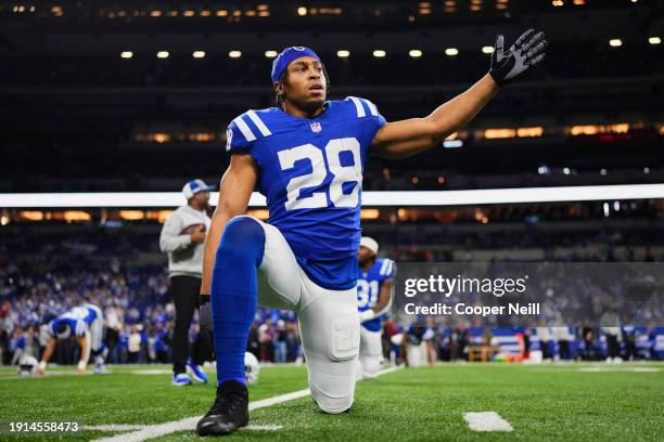 Jonathan Taylor of the Indianapolis Colts warms up before kickoff against the Houston Texans at Lucas Oil Stadium on January 6, 2024 in Indianapolis,...