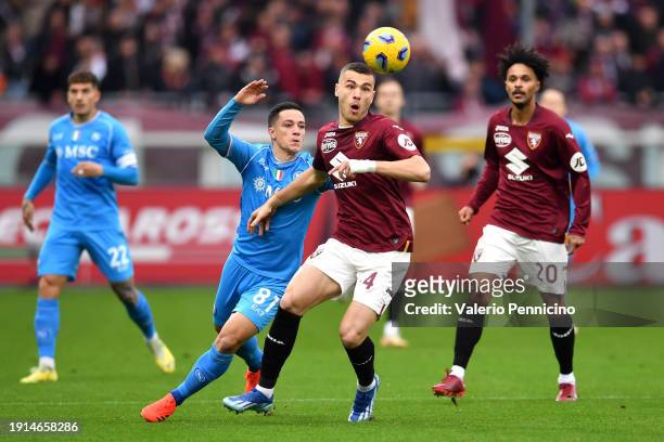 Giacomo Raspadori of SSC Napoli and Alessandro Buongiorno of Torino FC battle for possession during the Serie A TIM match between Torino FC and SSC...