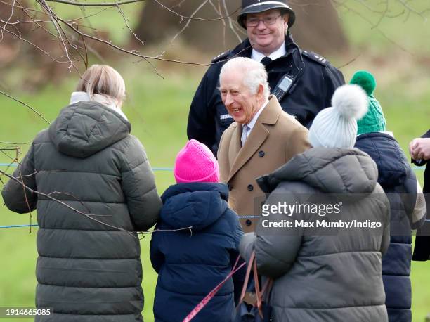 King Charles III talks with members off the public as he attends the Sunday service at the Church of St Mary Magdalene on the Sandringham estate on...