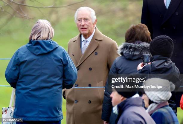 King Charles III talks with members off the public as he attends the Sunday service at the Church of St Mary Magdalene on the Sandringham estate on...