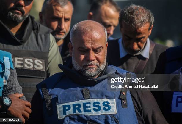 Family and friends including Al Jazeera reporter, Wael Al-Dahdouh, bid farewell to the bodies of journalists Hamza Al-Dahdouh and Mustafa Thuraya on...