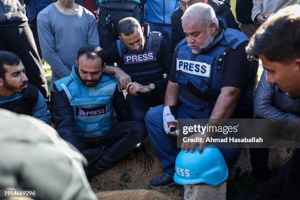 Family and friends including Al Jazeera reporter, Wael Al-Dahdouh , bid farewell to the bodies of journalists Hamza Al-Dahdouh and Mustafa Thuraya on...