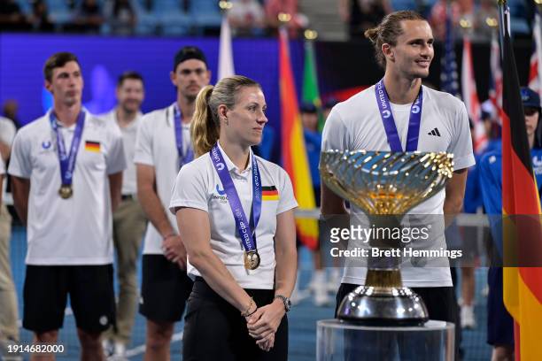 Angelique Kerber of Germany and Alexander Zverev of Germany participate in a ceremony following Germany's victory in the United Cup after Laura...