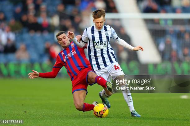 Stuart O'Keefe of Aldershot Town and Fenton Heard of West Bromwich Albion battle for the ball during the Emirates FA Cup Third Round match between...