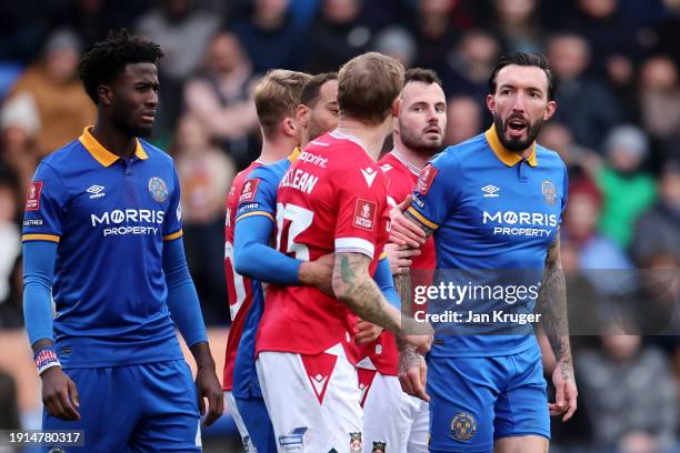 Ryan Bowman of Shrewsbury Town clashes with James McClean of Wrexham during the Emirates FA Cup Third Round match between Shrewsbury Town and Wrexham...