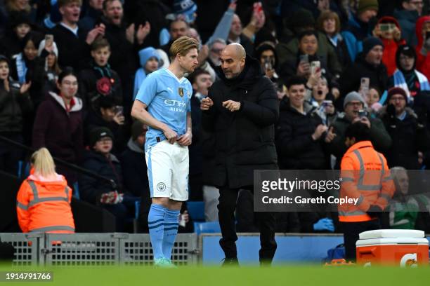 Pep Guardiola, Manager of Manchester City, gives instructions to Kevin De Bruyne of Manchester City during the Emirates FA Cup Third Round match...