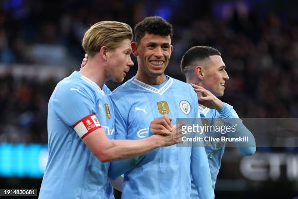 Kevin De Bruyne and Matheus Nunes of Manchester City celebrate after teammate Jeremy Doku scores their team's fifth goal during the Emirates FA Cup...