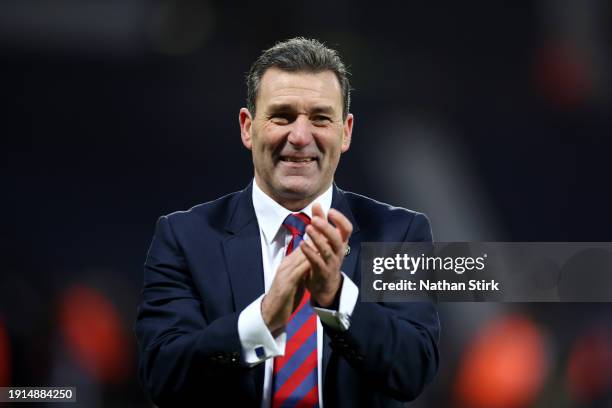 Tommy Widdrington, Manager of Aldershot Town shows appreciation to the fans following the Emirates FA Cup Third Round match between West Bromwich...
