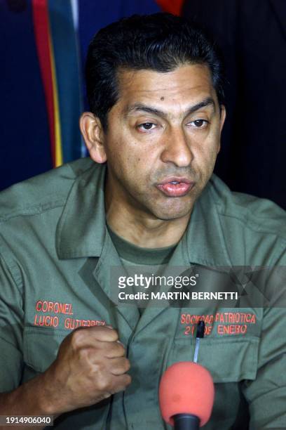 The Ecuatorian presidential candidate, retired colonel Lucio Gutierrez, answers questions during a press conference in Quito 20 October 2002. The...