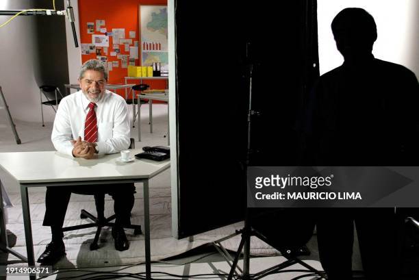 Brazilian presidential candidate of the Workers Party Luiz Inacio Lula da Silva smiles during a taping of a television advertisement for his...