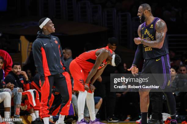 Los Angeles, CA, Tuesday, January 9, 2024 - Toronto Raptors guard Dennis Schroder and Los Angeles Lakers forward LeBron James share a chuckle during...