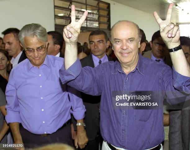 Jose Serra , presidential candidate for Brazil's Social Democratic Party, makes a victory sign during his visit to a popular restaurant in Samambaia,...