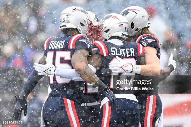 Chris Board, Matthew Slater and Brenden Schooler of the New England Patriots speak before a game against the New York Jets at Gillette Stadium on...