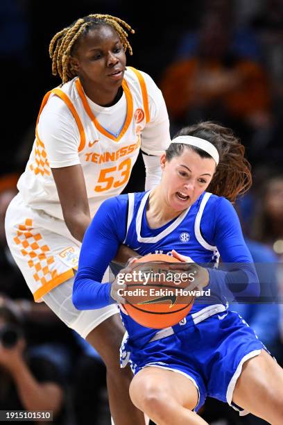 Emma King of the Kentucky Wildcats gets fouled by Jillian Hollingshead of the Tennessee Lady Vols in the first quarter at Thompson-Boling Arena on...