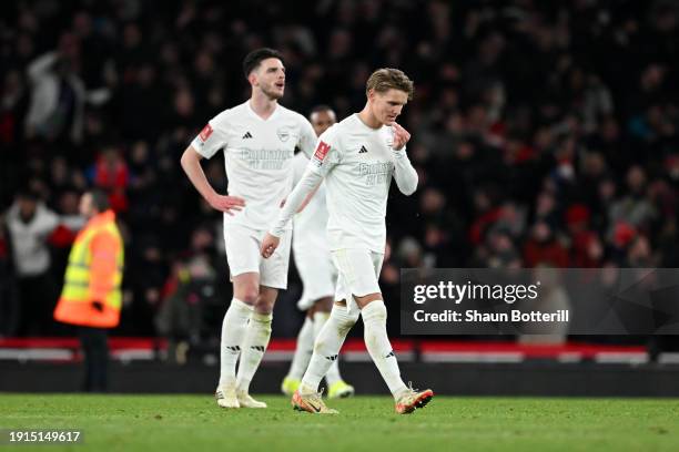 Martin Odegaard of Arsenal looks dejected after teammate Jakub Kiwior scores an own goal, resulting in Liverpool's first goal, during the Emirates FA...